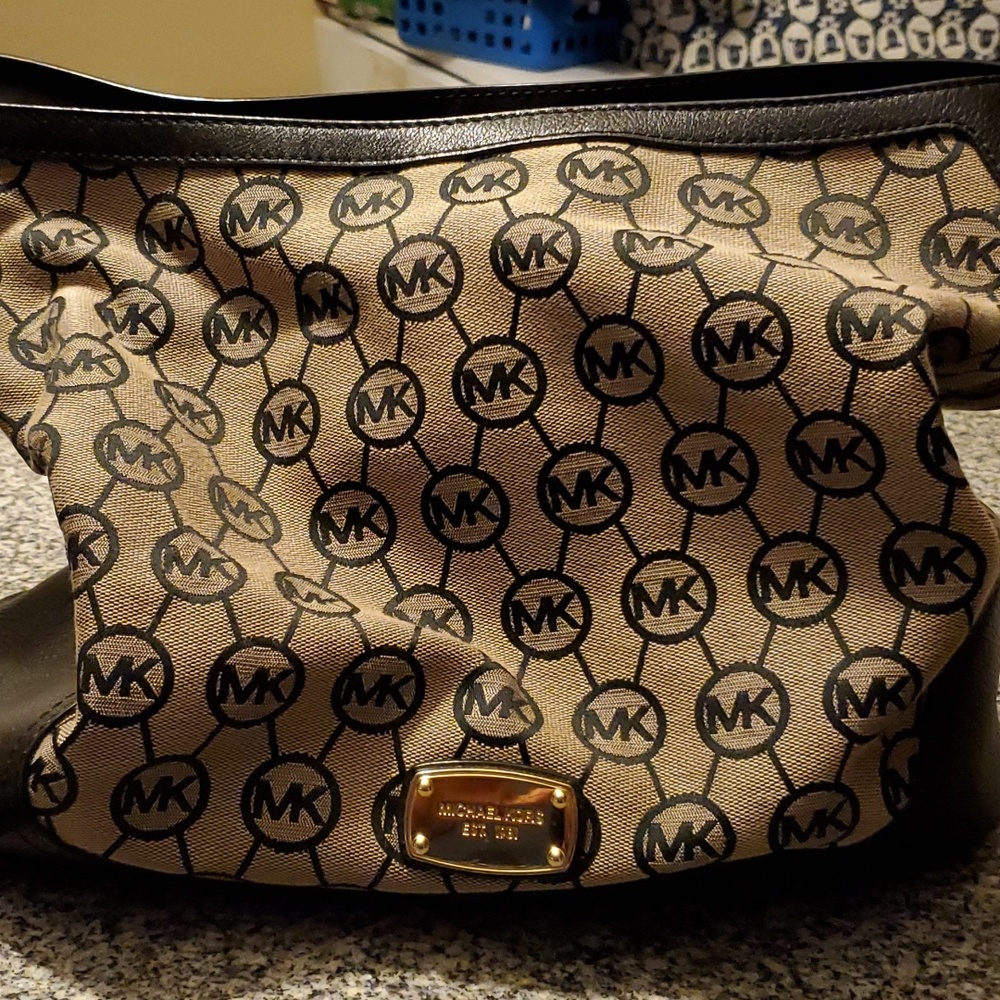 Black and brown Michael Kors logo purse